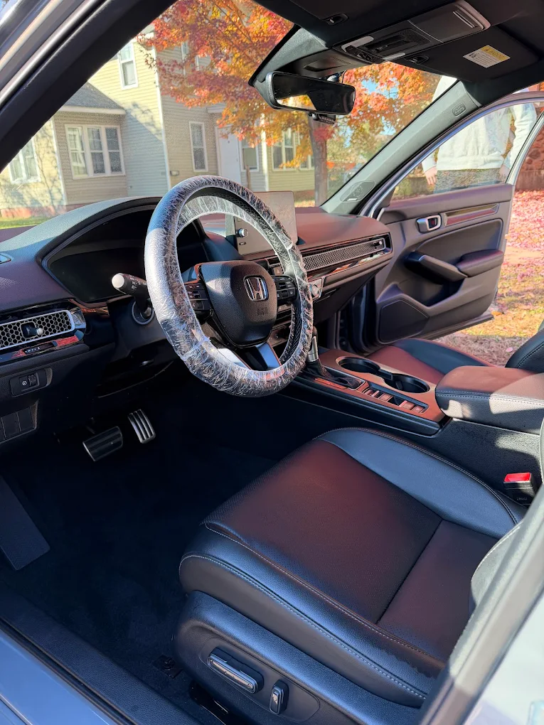 Freshly detailed Honda Civic interior with clean dash and seats